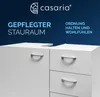 A close-up view of a white cabinet with drawers, set against a dark blue background with text and a logo. Produktbild-Vorschau