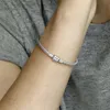 A person's arm wearing a silver bracelet. Produktbild-Vorschau