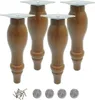Four wooden furniture legs with metal mounting plates are shown, along with screws and felt pads. Podgląd zdjęcia produktu
