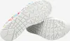The image shows the soles of two white women's shoes with a colorful abstract pattern on the upper part of one shoe. Voir les images du produit