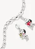 A close-up shot of a silver charm bracelet with two Snoopy charms attached. Anteprima dell’immagine prodotto