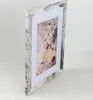 A framed picture of a woman with flowers on her head. Produktbild-Vorschau