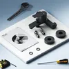 A black faucet and installation tools are laid out on a marble surface, suggesting a product display or installation guide. Produktbild-Vorschau