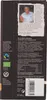 The back of a chocolate bar package with text and a photo of a person. Produktbild-Vorschau