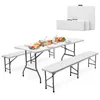A white folding table and two benches set up with food and drinks, with folded tables in the background. Produktbild-Vorschau