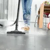 A person is using a steam cleaner on a floor. Produktbild-Vorschau