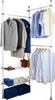 A freestanding, adjustable wardrobe system with multiple hanging rods and storage baskets, filled with clothing and accessories. Produktbild-Vorschau