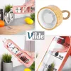 A collage of images showing a pink glass water bottle with a silicone sleeve and a bamboo lid, being used and its features. Voir les images du produit