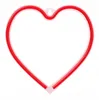 A red neon heart-shaped lamp is shown against a white background. Voir les images du produit