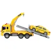A toy tow truck with a toy taxi on its ramp, against a white background. Anteprima dell’immagine prodotto