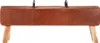 A vintage-style pommel horse or bench with leather upholstery and wooden legs, presented against a white background. Voir les images du produit