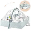 A baby play mat with arches and hanging toys, shown from a slightly elevated angle. Voir les images du produit
