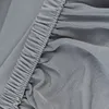 A close-up shot of a gray fabric with elastic ruching. Náhled obrázku produktu