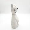 A white ceramic cat figurine shown in profile against a white background. Podgląd zdjęcia produktu