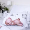 A close-up view of a pillow with a teddy bear design on a bed. Náhľad obrázku produktu