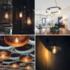 A collage of four images showcasing different types of vintage-style light bulbs and fixtures. Produktbild-Vorschau