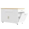 A white kitchen island with a wooden countertop is shown against a white background. One of the cabinet doors is open, revealing storage space inside. The island has gold-colored handles and wheels at the base. Produktbild-Vorschau