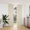 A room with a window covered by cream curtains, a plant, and a dresser. Produktbild-Vorschau