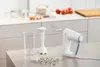 A kitchen counter with baking ingredients and a hand mixer set. Podgląd zdjęcia produktu
