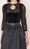 A woman wearing a black dirndl top and skirt. Produktbild-Vorschau
