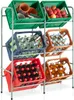 A metal rack filled with various crates containing items like pottery, fruits, and bottles of beverages. Náhled obrázku produktu