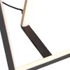 A close-up shot of a modern geometric LED table lamp. Náhľad obrázku produktu