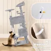 A cat is interacting with a tall, multi-level cat tree that is leaning against a wall. The image also includes close-up insets showing how the cat tree attaches to the wall for stability. Produktbild-Vorschau
