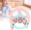 Rosa und mintgrünes Baby-Lenkradspielzeug mit Knöpfen und Tacho, mit lächelndem Baby im unscharfen Hintergrund Náhľad obrázku produktu