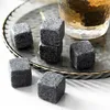 Whiskey stones and a glass of whiskey on a decorative tray. Produktbild-Vorschau