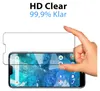 A hand is holding a screen protector over a smartphone screen. Produktbild-Vorschau