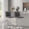 Two dark gray bar stools are shown in a modern kitchen setting. Náhľad obrázku produktu