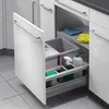 A pull-out kitchen cabinet organizer with trash bins and cleaning supplies. Podgląd zdjęcia produktu