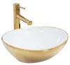 A gold and white washbasin with a gold faucet. Podgląd zdjęcia produktu