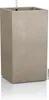 A tall, square, sand-colored planter with a water level indicator visible at the top. Anteprima dell’immagine prodotto