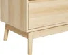 A close-up view of the bottom corner of a light wood-toned cabinet with three drawers. Podgląd zdjęcia produktu