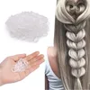 A collage showing a pile of clear hair ties and a woman's hair styled in a braid with heart shapes, using hair ties. Anteprima dell’immagine prodotto