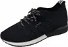 A black sneaker with white laces and a white sole is shown against a white background. Náhled obrázku produktu