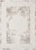 A rug with a distressed, ornate pattern. Voir les images du produit