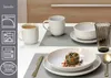 A table setting with plates, bowls, mugs, and cutlery, featuring a portion of pasta. Produktbild-Vorschau