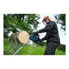 A person wearing safety gear is using a chainsaw to cut a log. Anteprima dell’immagine prodotto