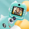 A close-up of a teal-colored toy camera with a screen displaying a happy child, and a separate view of the camera's lens. Náhľad obrázku produktu