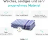 A folded blue checkered towel with purple stripes, surrounded by marketing text and icons highlighting its features. Anteprima dell’immagine prodotto