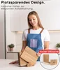 A woman in an apron is standing in a kitchen, holding a stack of wooden cutting boards. A close-up inset shows a wooden holder for the cutting boards. Náhled obrázku produktu