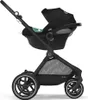 A black stroller with a green insert, shown from the side against a white background. Voir les images du produit