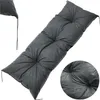 A dark gray tufted cushion for an outdoor sofa or bench, shown from a diagonal angle against a white background. Náhled obrázku produktu