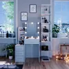 A well-lit room with a vanity table, shelves, and a window overlooking a snowy landscape. Náhled obrázku produktu