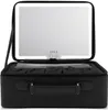 A black makeup case with a built-in LED mirror is open, showing the interior. Produktbild-Vorschau