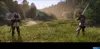 Two knights in armor are facing each other in a grassy field, holding swords. Produktbild-Vorschau