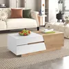 A modern living room with a couch, coffee table, and ottoman. Náhľad obrázku produktu