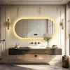 A modern bathroom vanity with a large oval LED mirror, sink, and faucet. Podgląd zdjęcia produktu